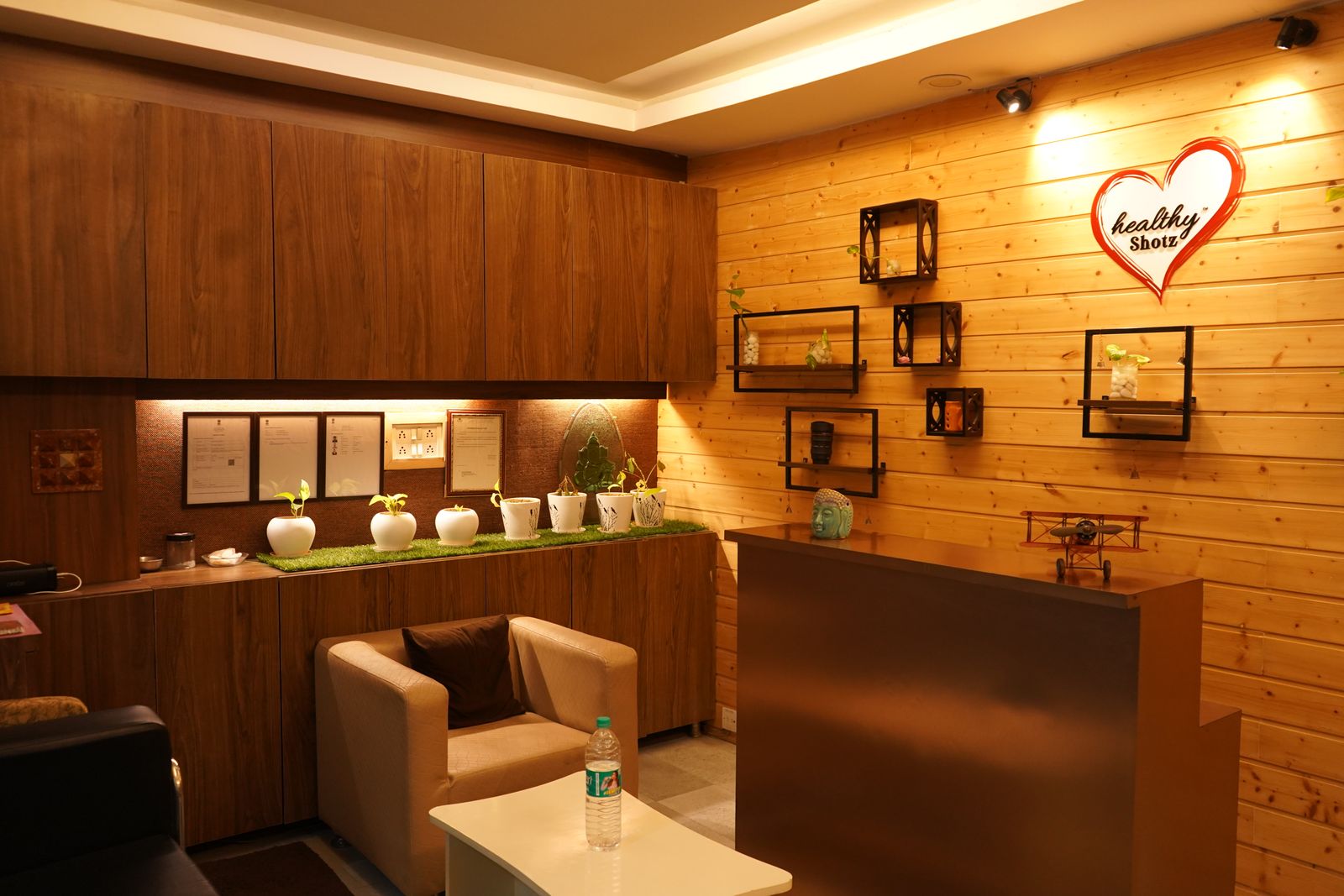 Warm office reception area with wooden decor and plants