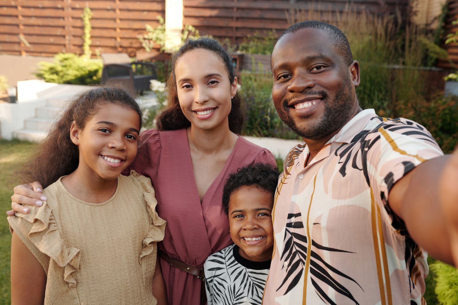 Multigenerational family talking together in a garden